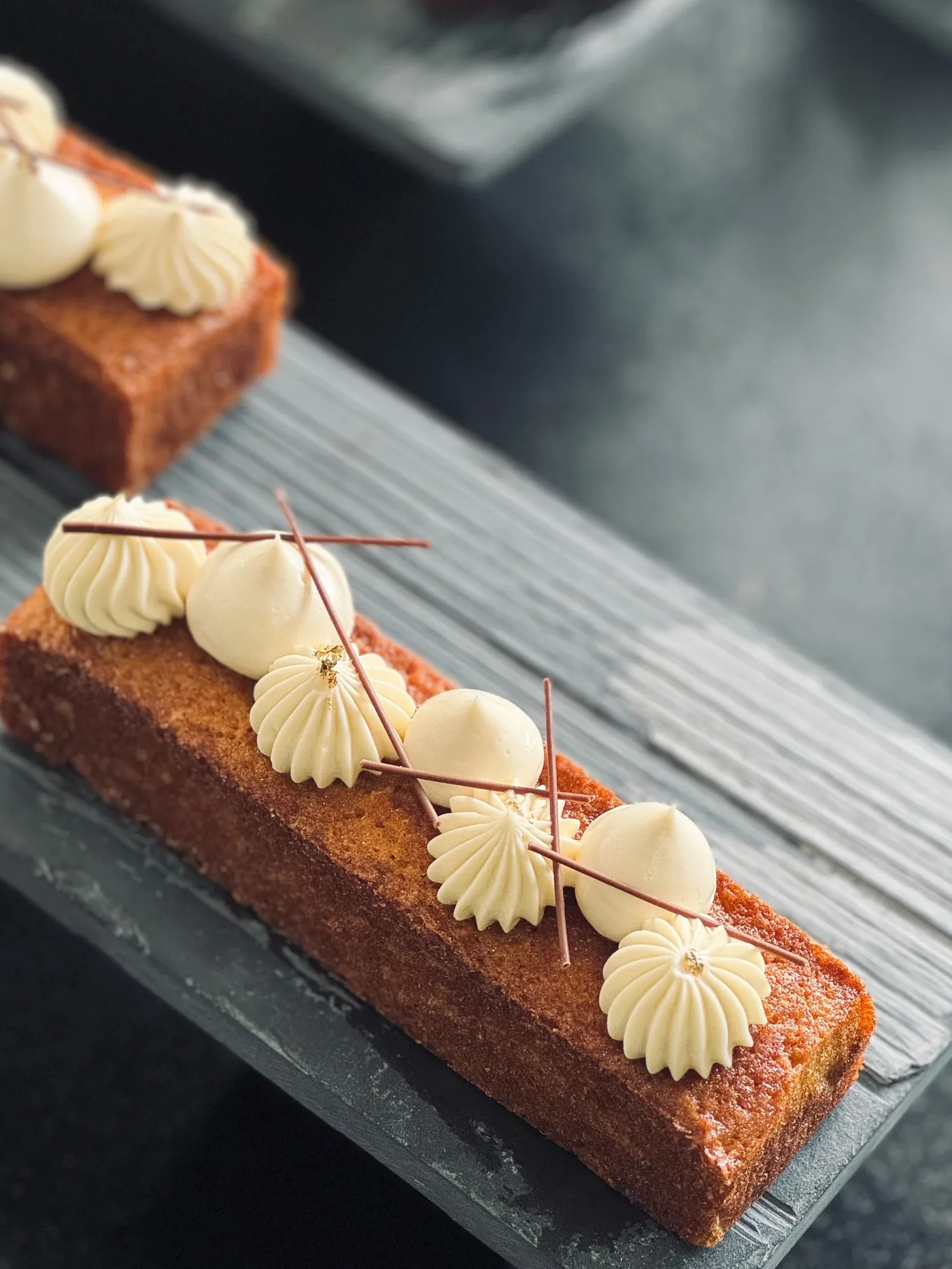 Brown Butter Financier — almond financier bar with vanilla cream rosettes, chocolate quills and gold leaf